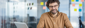 mature-hispanic-businessman-smiling-while-working-2024-04-09-17-52-36-utc